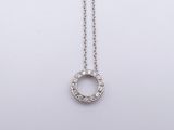 a white gold necklace with a diamond circle pendant on a chain