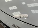 a sticker on the hood of a white car