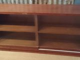 an image of a wooden bookcase in a living room