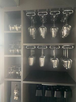 a wine glass rack with wine glasses on it