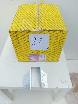 the box is sitting on a table with a piece of paper in it
