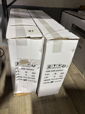 two boxes that are stacked on top of each other on the floor