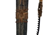a knife that is tied to a wooden pole