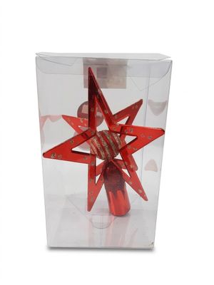 une décoration en forme d'étoile rouge dans une boîte transparente