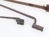 two old tools that are sitting on a white surface