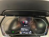 the dashboard of a car with a digital display in the center