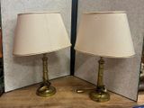 two lamps that are sitting on a table