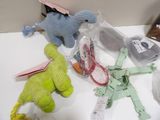 many stuffed animals that are on a white table