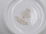a close up of a plate with a crest on it