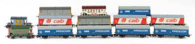 a lot of toy trains that are lined up on the tracks