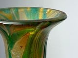 a glass vase that is sitting on a table