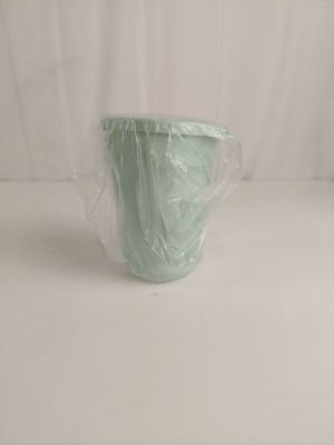a plastic cup that is wrapped in plastic