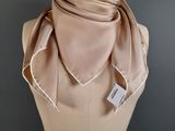 a close up of a mannequin torso with a scarf on it