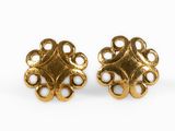 a pair of gold toned earrings with a circular design