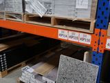 many boxes of granite on the shelves in the store