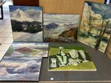 four paintings on a table in a room