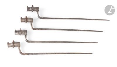 a set of four old metal tools sitting on top of a white surface