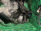 a green crate with a bunch of wires in it