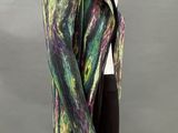 an image of a mannequin wearing a colorful jacket and black pants