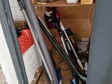 several baseball bats and baseball bats are sitting on a shelf