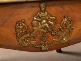 a close up of a wooden table with a clock on top of it