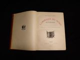 an open book with a picture of a cat on it