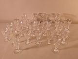 a lot of wine glasses sitting on a table