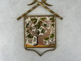 a picture of a birdhouse with a tree on it