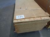 a stack of plywood in a warehouse with a price tag on it