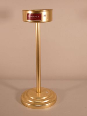 a gold pedestal with a red sign on top of it
