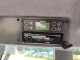 a radio in the back of a car with a remote control