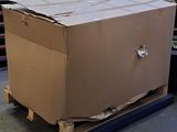 a large cardboard box on a pallet in a warehouse