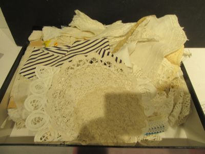 a box that has a lot of doily on it