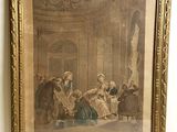 une vieille photo d'un groupe de personnes assises autour d'une table