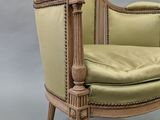 an image of a chair with a green upholstered seat