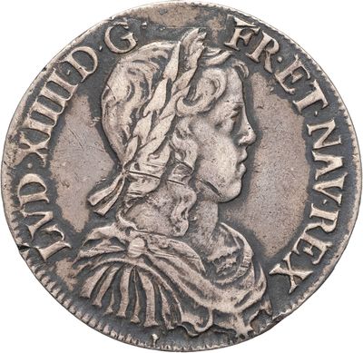 une pièce en argent représentant une femme portant une coiffe