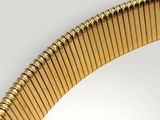 an image of a close up of a gold bracelet on a white surface