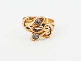 an image of a gold ring with two diamonds on it