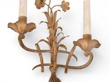 a wall mounted candle holder with two candles on it