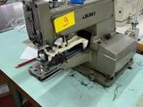 a sewing machine that is sitting on a table