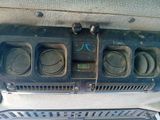a close up of a car ' s dashboard with a lot of buttons