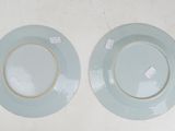 two plates that are sitting on a table