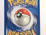 a pokemon card with a red and white ball on it
