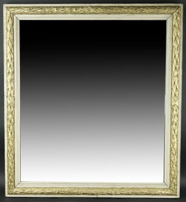 Miroir en bois et stuc peint et doré à encadrement de guirla…