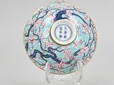 an oriental blue and white bowl with a bird design on it