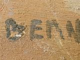 a close up of a piece of wood with writing on it