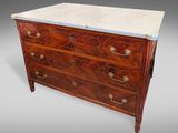 an antique chest of drawers with marble top