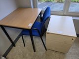 a desk and a chair in a corner of a room