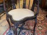 a chair that is sitting on a rug in a room