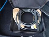 a suitcase with a hose in it sitting on the floor